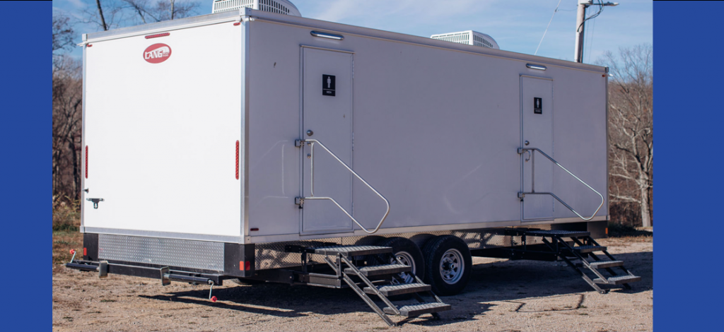 Multi-unit restroom trailer on a job site from Affordable Portables.